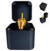 A dark blue gift box containing a golden middle finger prank item and an accessory tool.