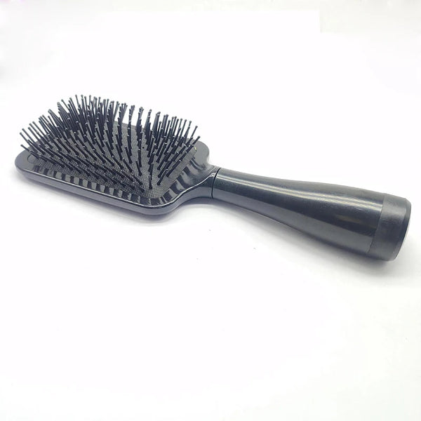 A black hair brush with numerous fine bristles is shown on a white background.
