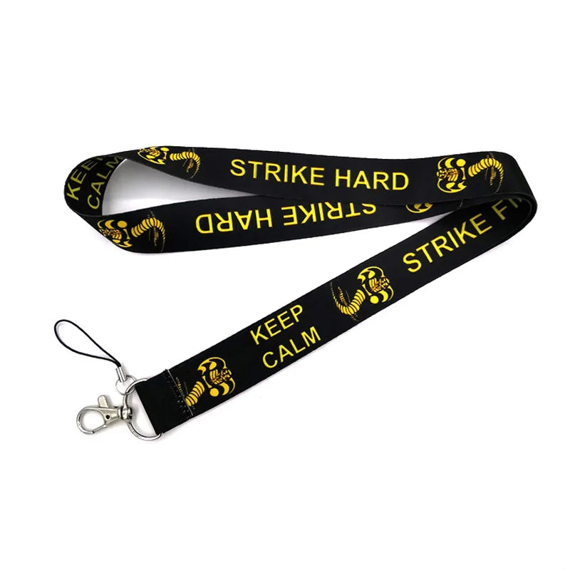 Black anime snake lanyard with 'STRIKE HARD' and 'KEEP CALM' text