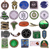 A collection of movie-themed enamel pins and brooches featuring characters and symbols from Lord of the Rings, The Hobbit, an