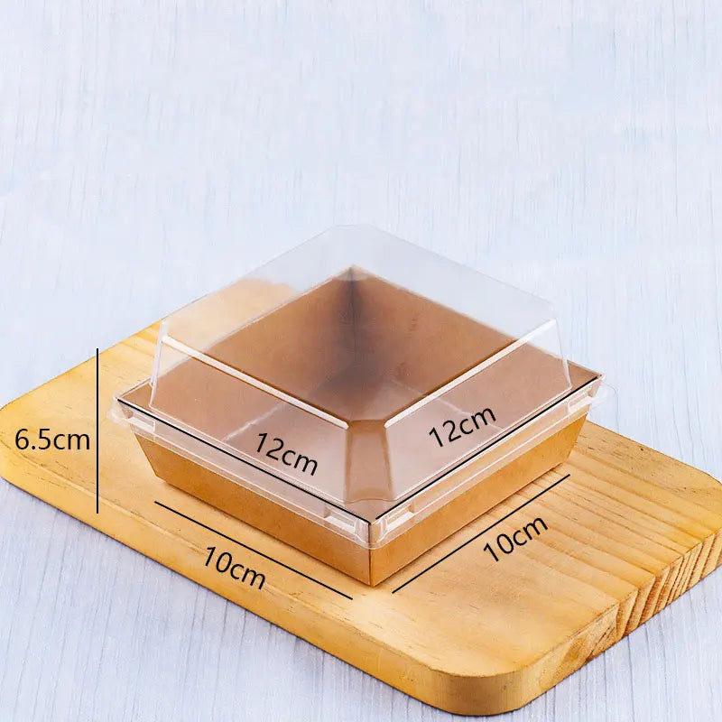 A square clear plastic food container with wooden base and measurements showing its dimensions.
