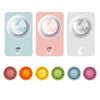 A set of colorful stackable food-grade ice molds for cocktails in various shades of pink, orange, green, and blue.