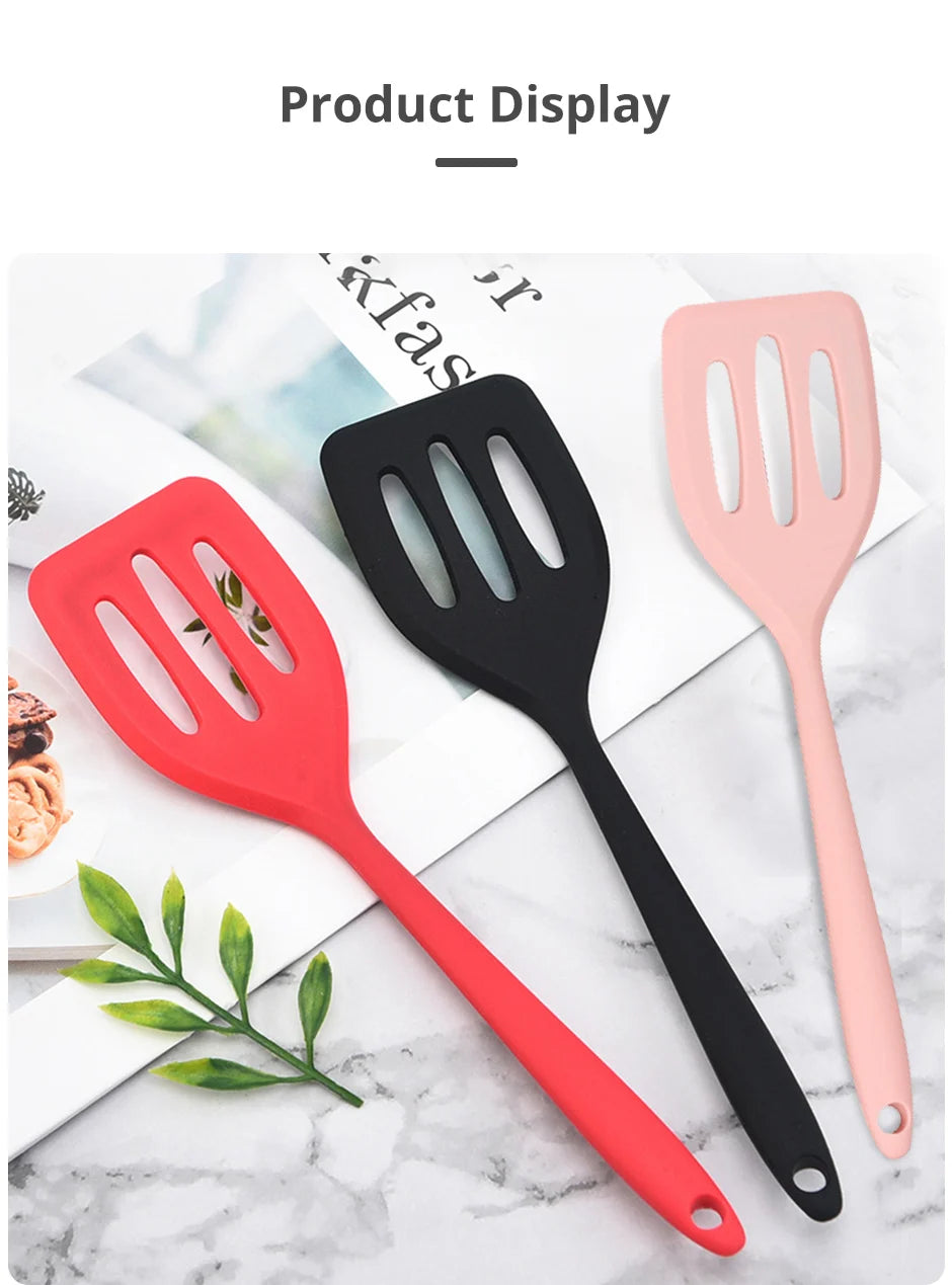 Three silicone flat bottom frying spatulas in red, black, and pink displayed on a white surface.