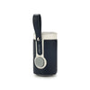 A dark blue baby bottle warmer with a black carrying strap and a light cream top.