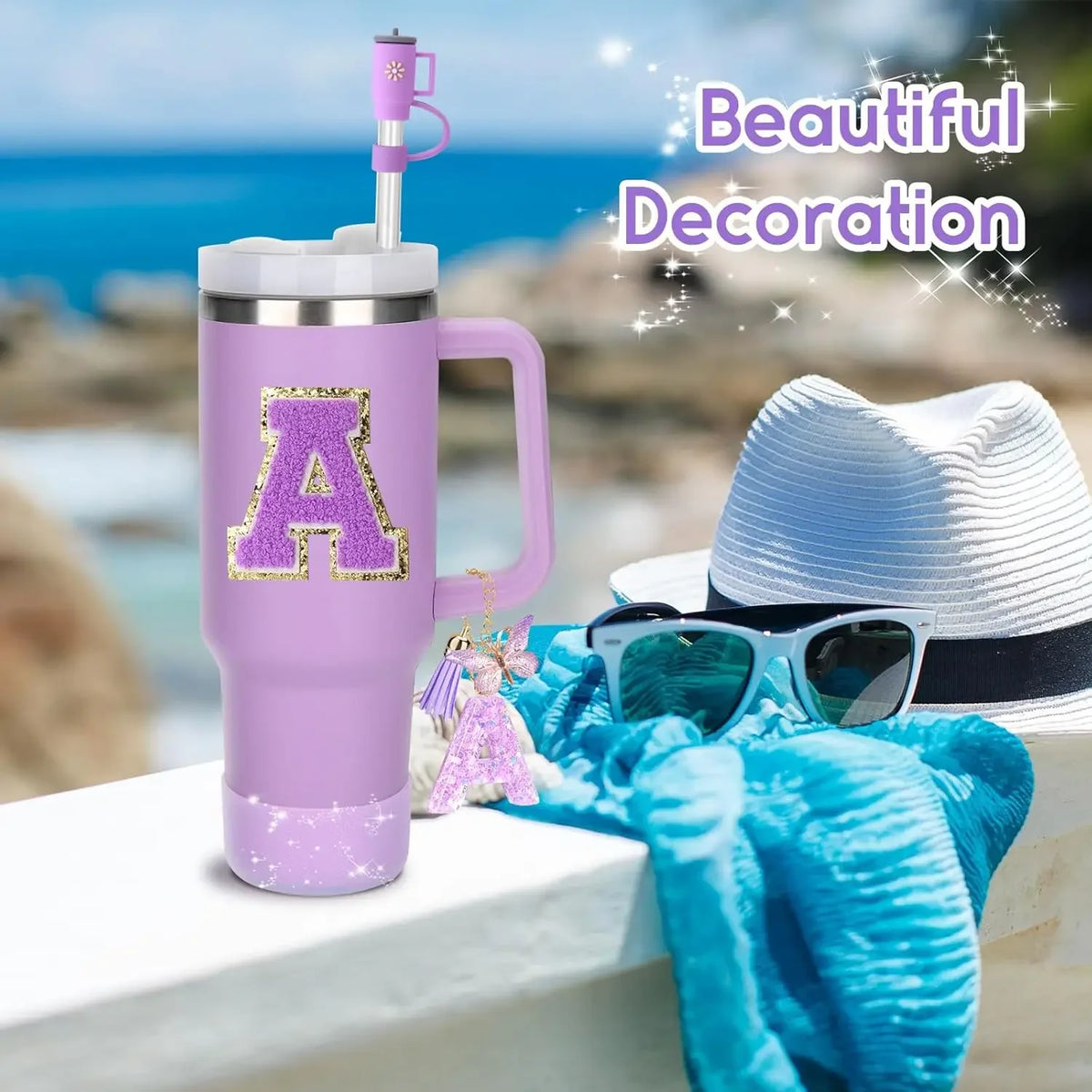 A purple tumbler mug with a gold letter A decoration is shown outdoors with a straw topper and sunglasses.