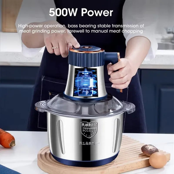 A hand is operating a 500W electric meat grinder and food chopper with a stainless steel base.