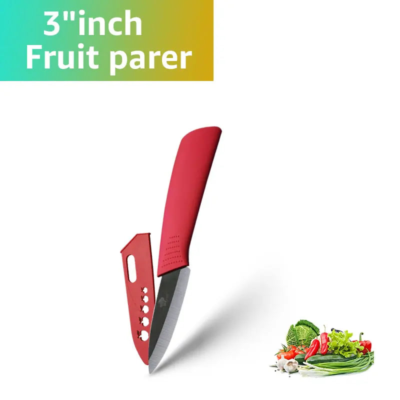 A red ceramic fruit parer knife is shown next to fresh vegetables.