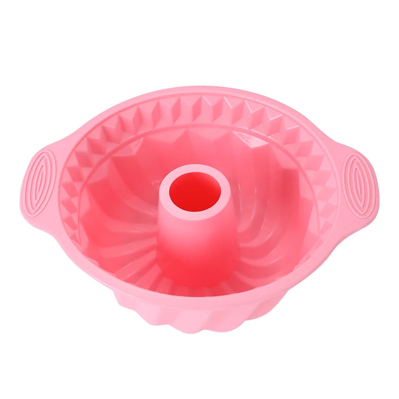 Pink nonstick silicone baking set with multiple molds and a central tube for cakes