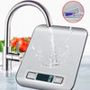 A stainless steel faucet is shown dispensing water into a modern digital kitchen scale.
