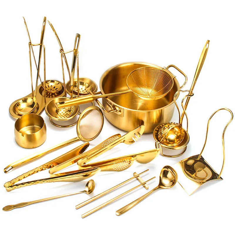A set of golden stainless steel hot pot colanders and serving utensils.