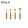 Four stainless steel spoons with wooden handles for measuring