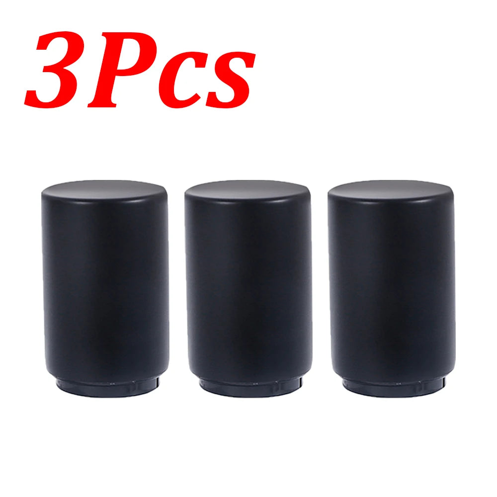 Three black stainless steel automatic bottle opener caps.