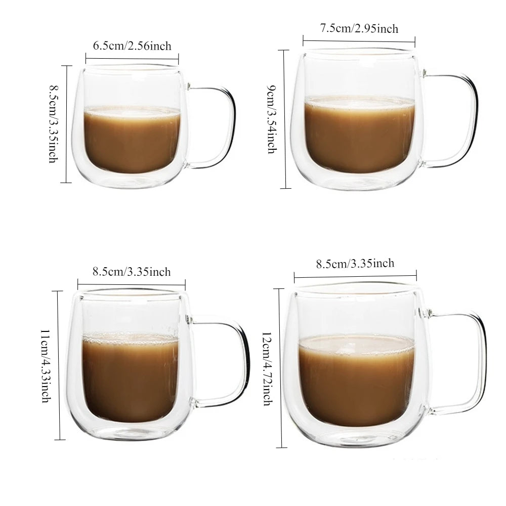 Clear double wall insulated glass coffee cups with handles filled with brown liquid
