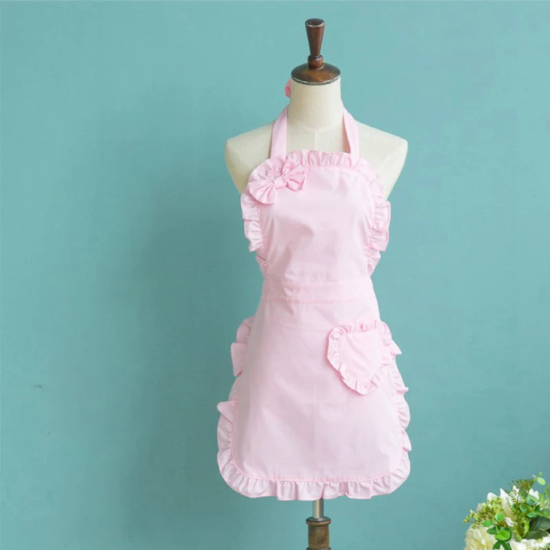 Pink princess heart bow apron displayed on a mannequin