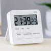A white digital kitchen timer displaying 21:39:23 with function buttons.