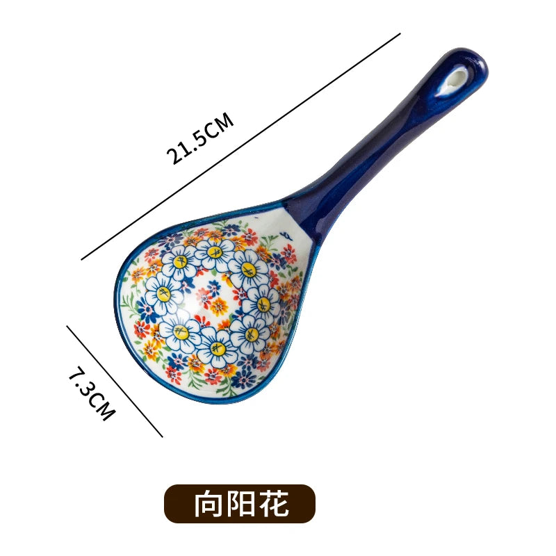 A blue ceramic ladle with a floral pattern, measuring 21.5cm in length and 7.3cm in width.
