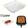 A single stainless steel grill rack is shown, with a smaller version placed inside a black frying pan.