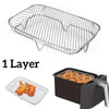 A single stainless steel grill rack is shown, and a similar rack is placed inside a black frying pan.