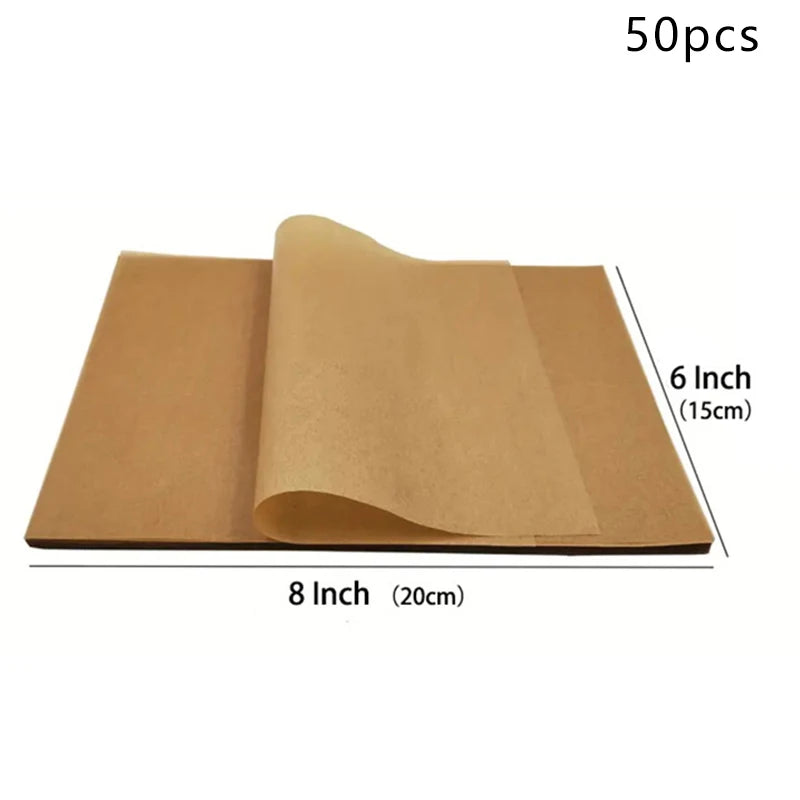 A stack of 50 non-stick baking sheets made of premium parchment paper, measuring 8 inches by 6 inches.