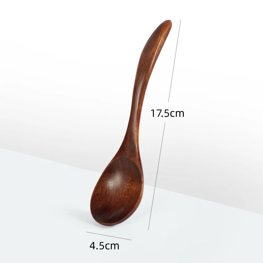 A wooden stirring spoon with a curved handle, measuring 17.5cm in length and 4.5cm in width.