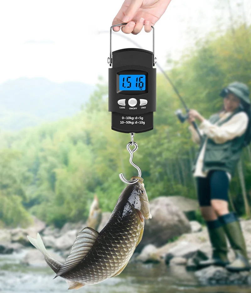 A hand holds a black portable digital hanging scale with a measuring tape, suspended over a fish in a river.