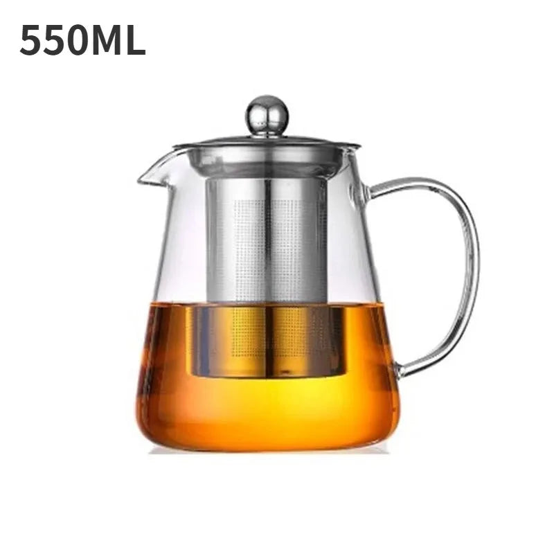 A clear glass teapot with a stainless steel infuser is shown, filled with amber-colored liquid.