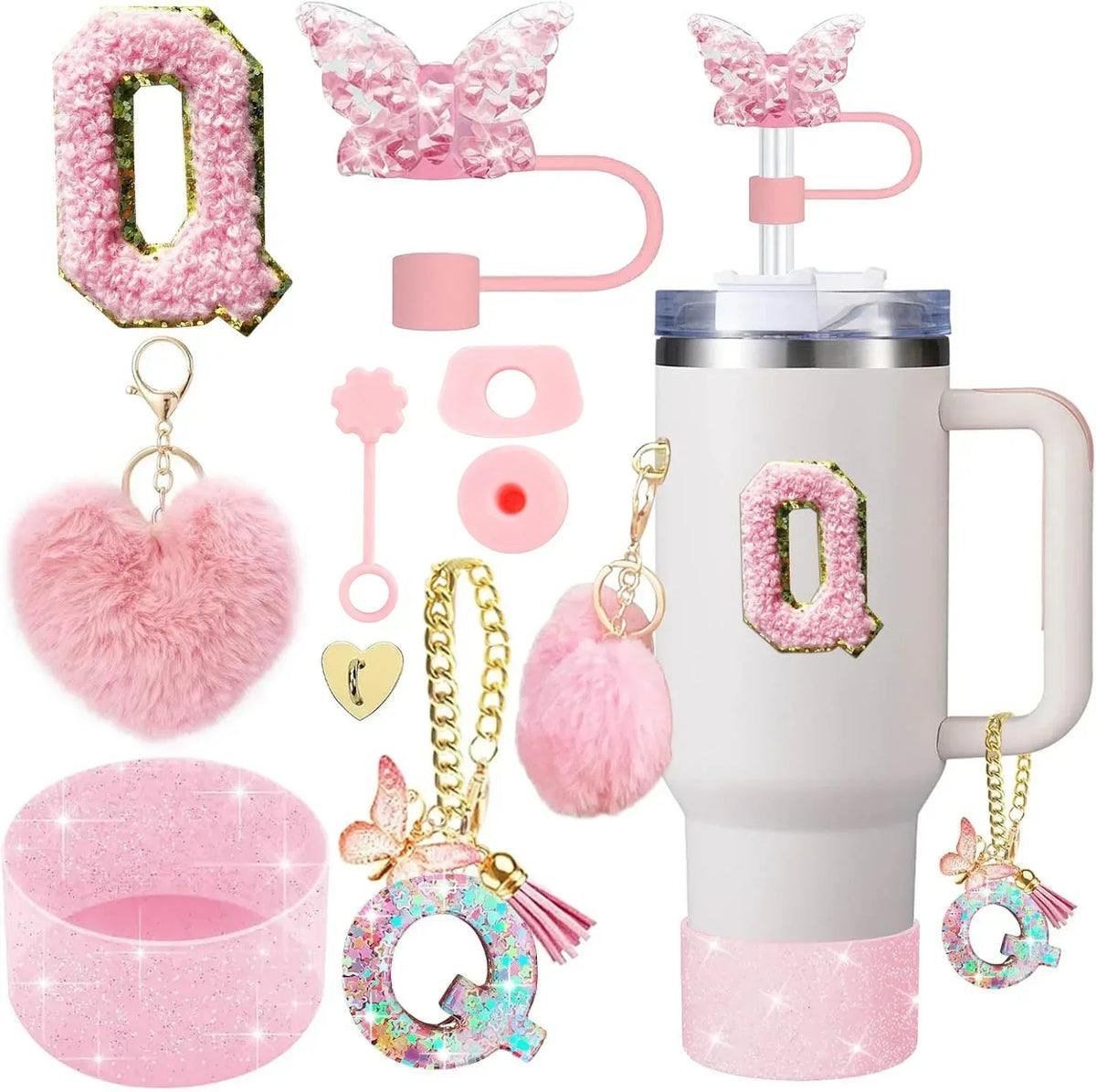 A pink tumbler accessory kit featuring a silicone boot, straw covers, and charm decorations for personalization.