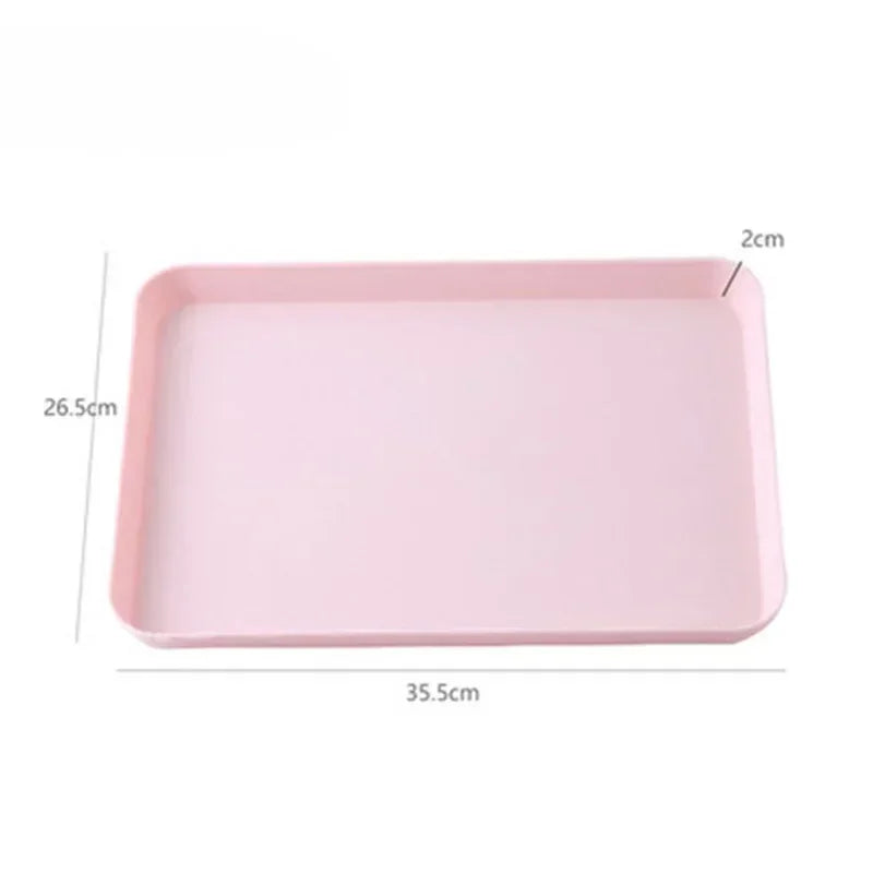 A rectangular pink plastic serving tray with dimensions 26.5cm by 35.5cm.