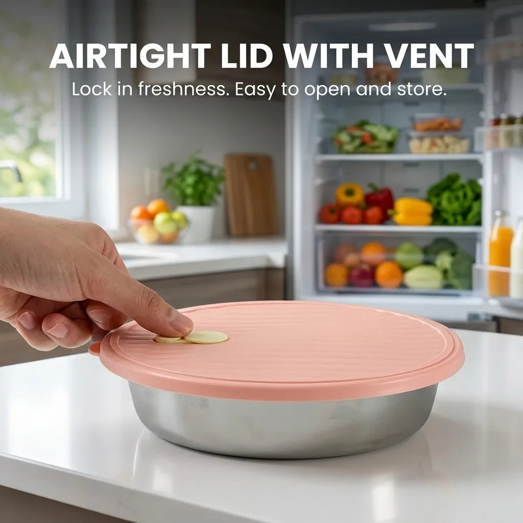 A hand places a pink lid on a stainless steel bowl, demonstrating an airtight lid with vent for food storage.