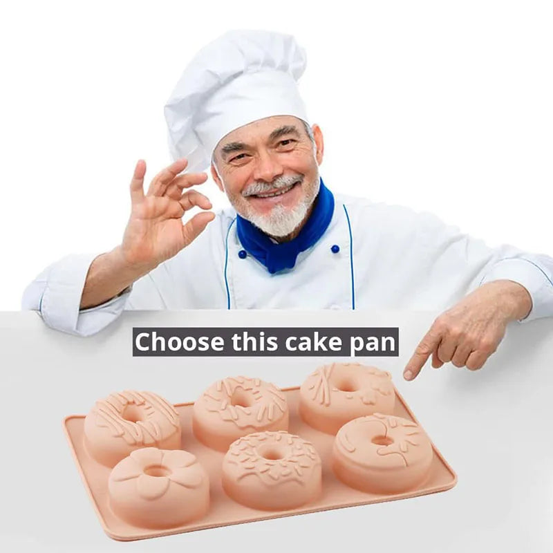 A smiling man in a chef's coat holds up a tray of six silicone mini donut cake pans.