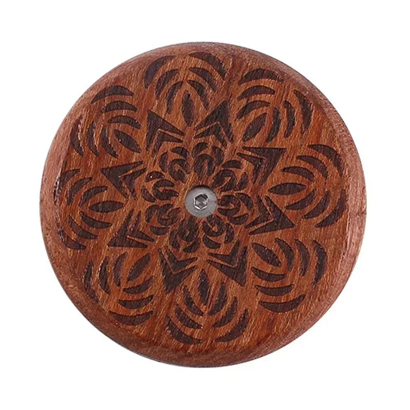A round wooden bread scoring tool with intricate geometric patterns carved into the surface.