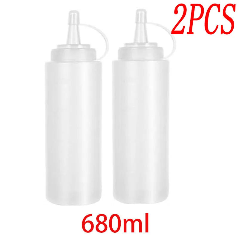 Two white multi-use squeeze condiment bottles with black caps and white labels, labeled 680ml.