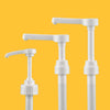 A white precision syrup dispenser pump with a long spout is shown against an orange background.