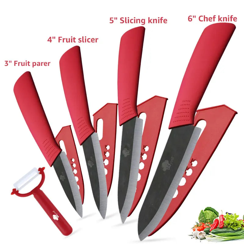A set of three red ceramic knives, including a 3 inch fruit parer, 4 inch fruit slicer, and 5 inch slicing knife, displayed w