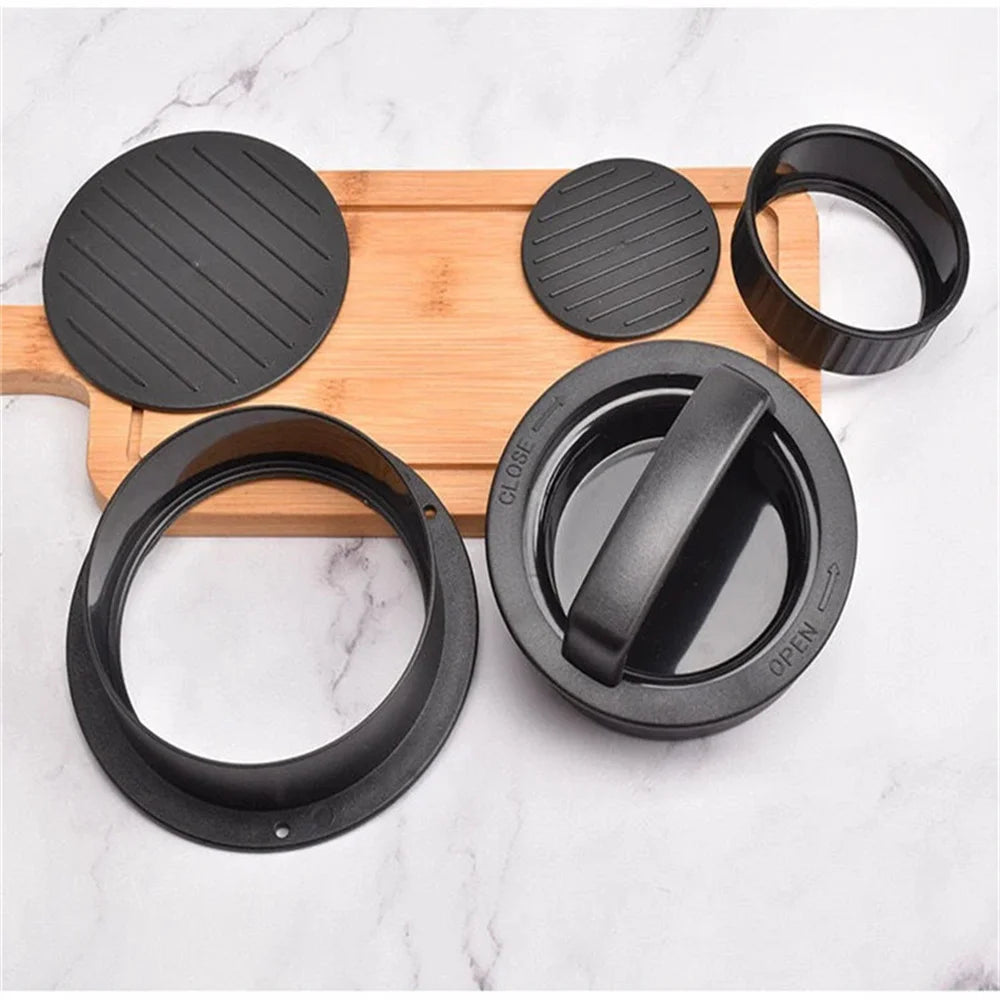 A black 3-in-1 hamburger meat press tool with various circular and oval pressing plates shown on a wooden board.