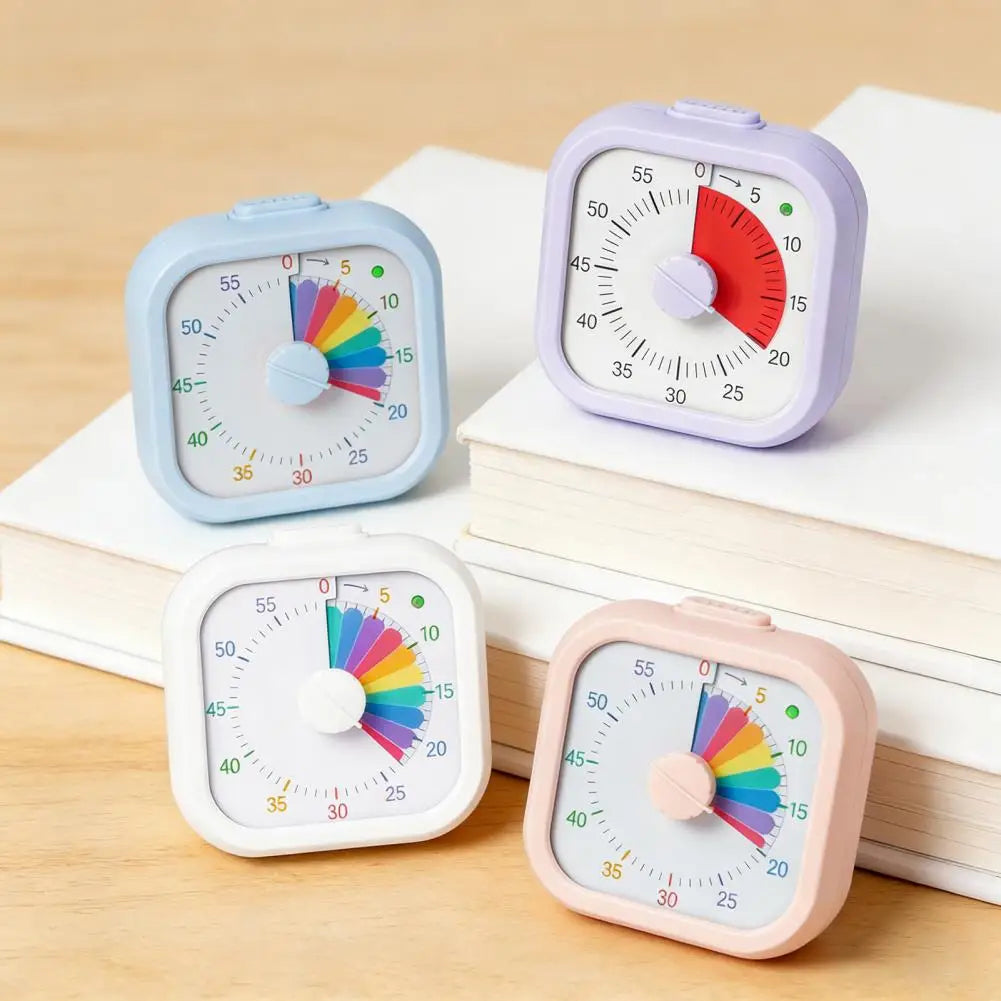 Three plastic visual timers for kids in blue, purple, and pink, showing different countdown scales.