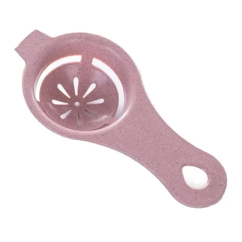 A pink silicone multi-piece egg white and yolk separator set with a perforated bowl.