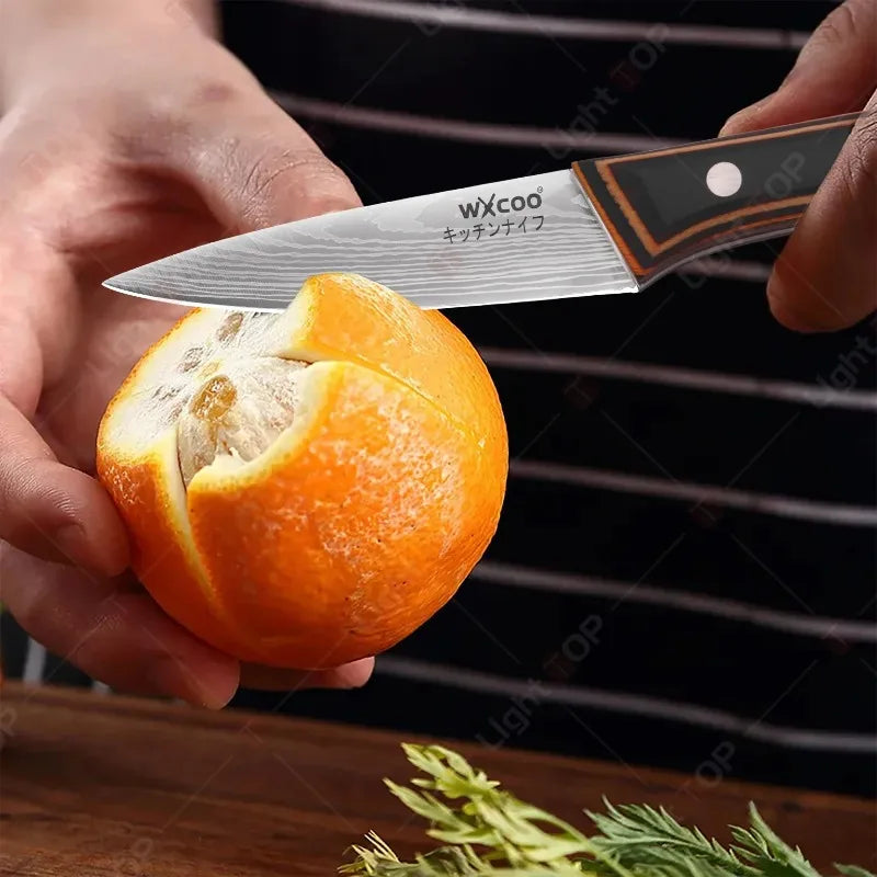 A hand holds an orange fruit above a 7-inch Japanese Santoku Chef Knife with a wood handle.