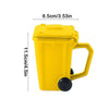 Yellow novelty trash can with a handle and measuring markings.