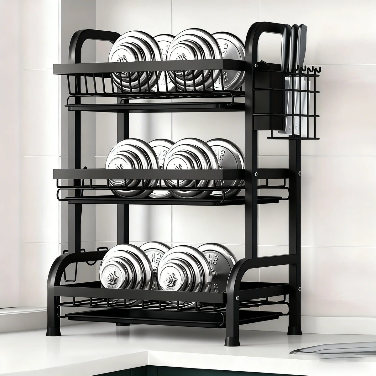 A black 3-tier vertical kitchen utensil dish rack holding various circular dishes and utensils.