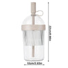 Clear reusable tumbler coffee cup with a straw lid and a light beige silicone base
