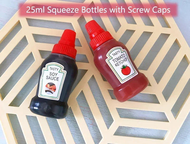 Two 25ml squeeze bottles with screw caps, one dark soy sauce and one red tomato ketchup, resting on a light wooden cutting bo