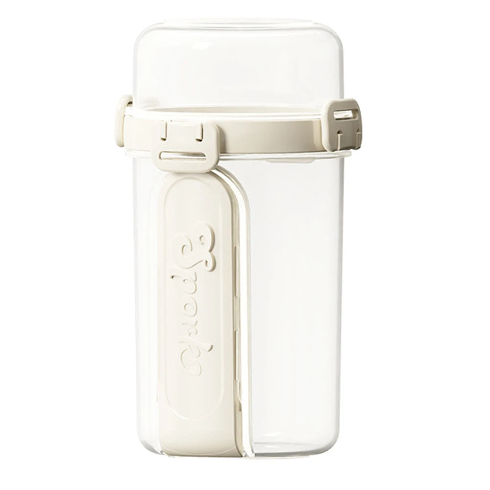 A clear reusable container with a light beige lid and clip, used for storing overnight oats or snacks.