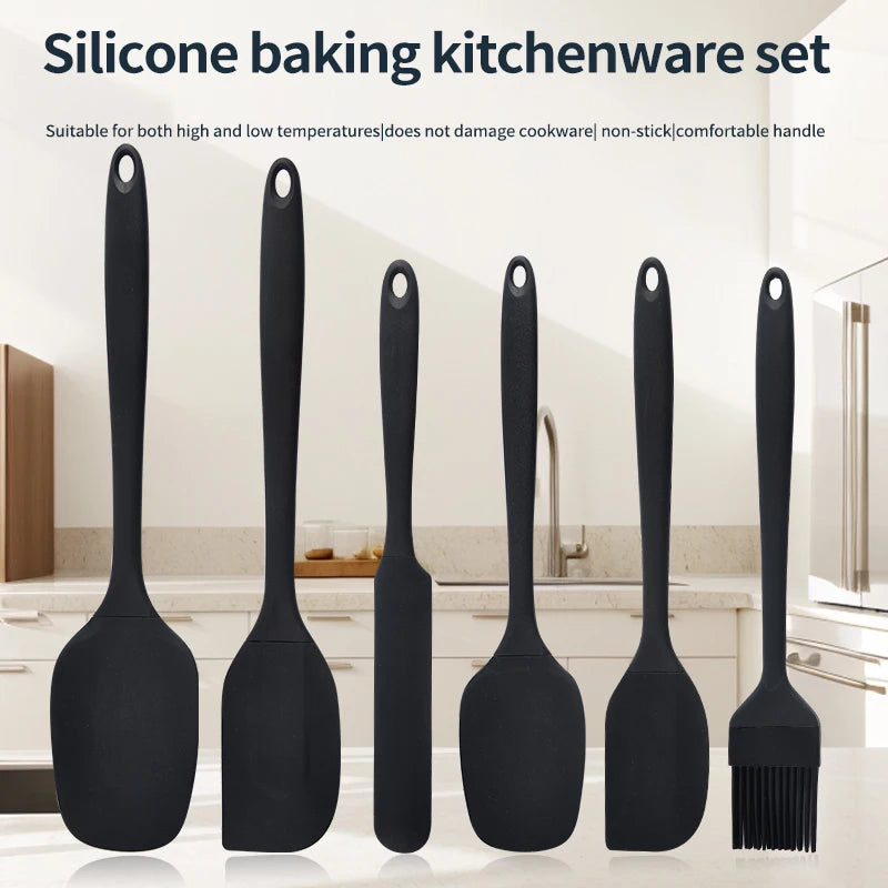 A set of six black silicone baking kitchen tools including spatulas and a brush