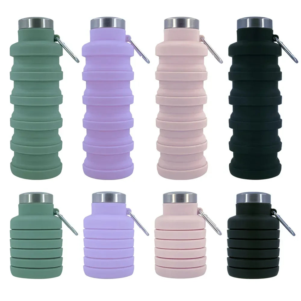 A set of four collapsible silicone water bottles in shades of green, purple, pink, and black.