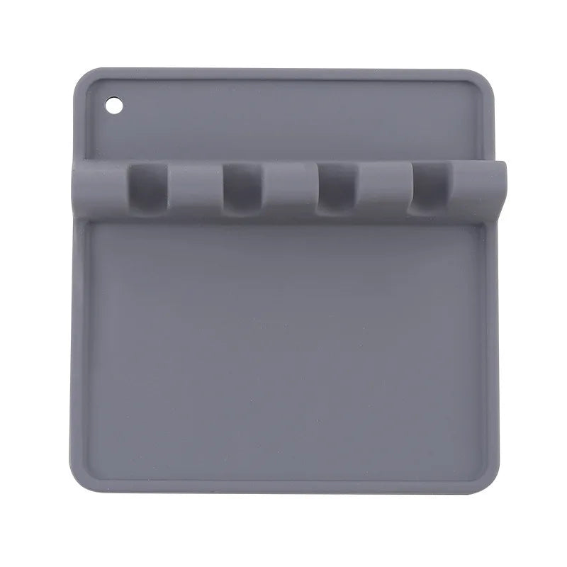 A gray silicone utensil drying rack organizer with a slotted tray and a hanging hole.