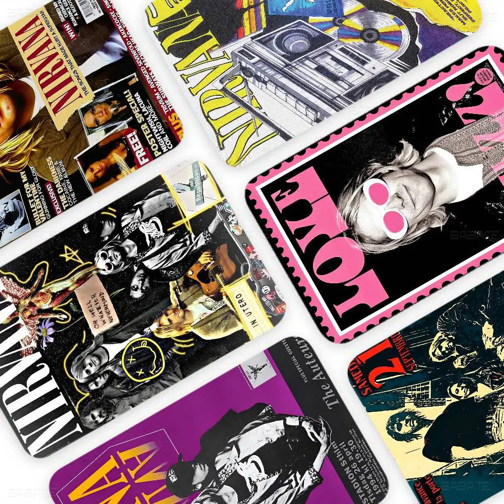 A collection of debit card stickers featuring the Nirvana band and anime artwork.