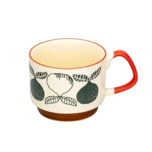 Tasse à café en céramique japonaise rétro avec intérieur beige clair, bord orange et motifs de feuilles vertes.