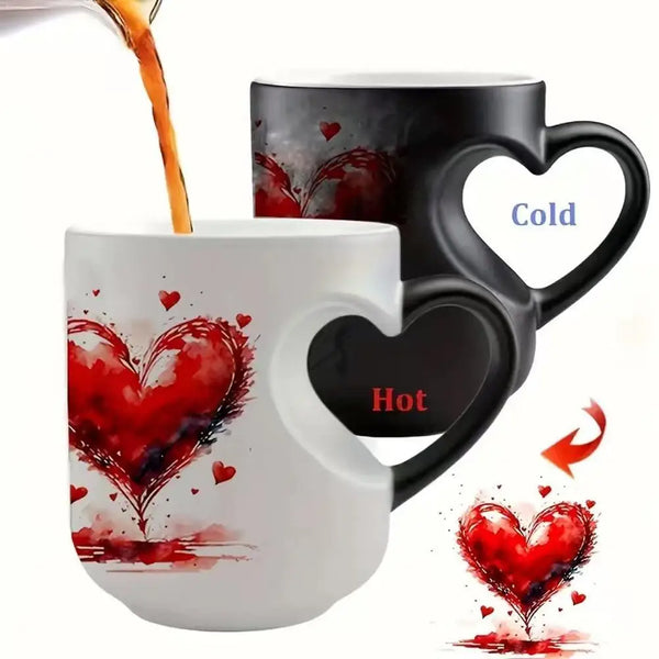 A white ceramic mug with a red heart design, showing both hot and cold liquid effects.