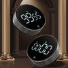 A close-up of a black magnetic kitchen timer with a digital display showing 09:55, set against a dark background.